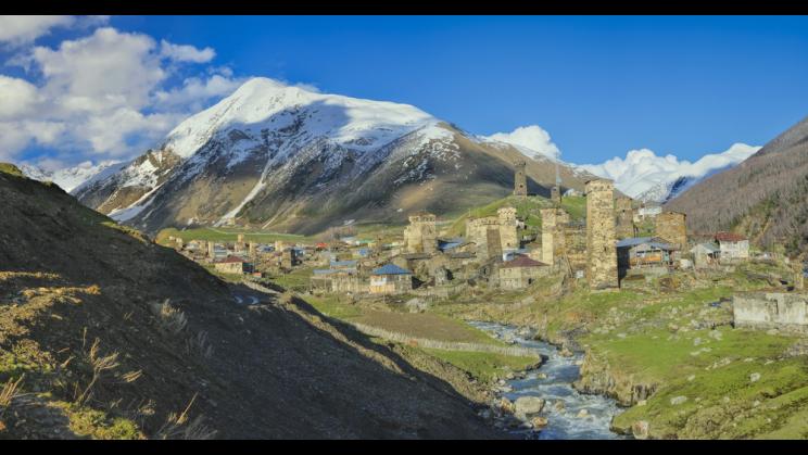 Caucasus mountains with traditional stone towers in Svaneti, Georgia.