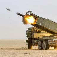 US soldiers fire a High Mobility Artillery Rocket System (HIMARS) during a joint live-fire exercise with the Kuwait Land Forces.