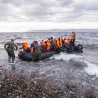Syrian refugees arrive by boat in Greece